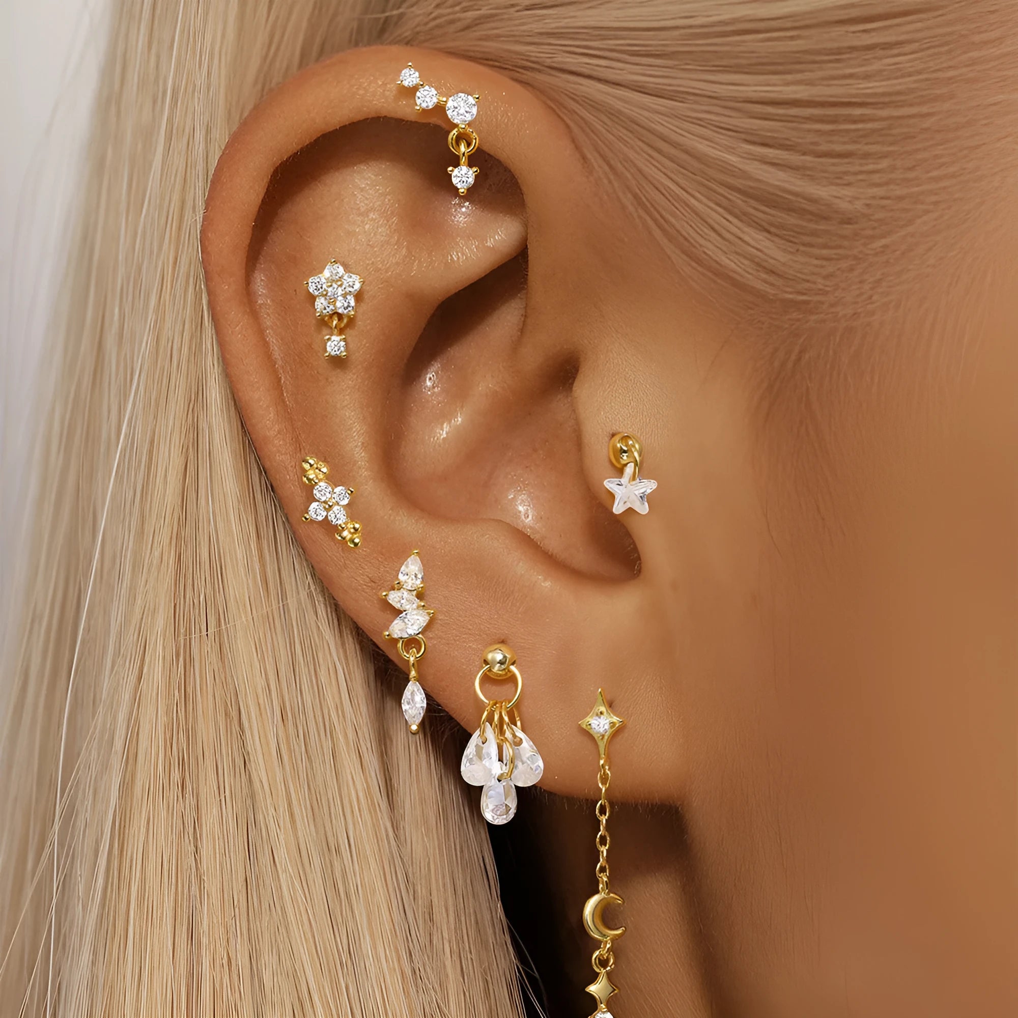 S925 sterling silver moon and star earrings with embedded diamond accents in a gold colour finish.