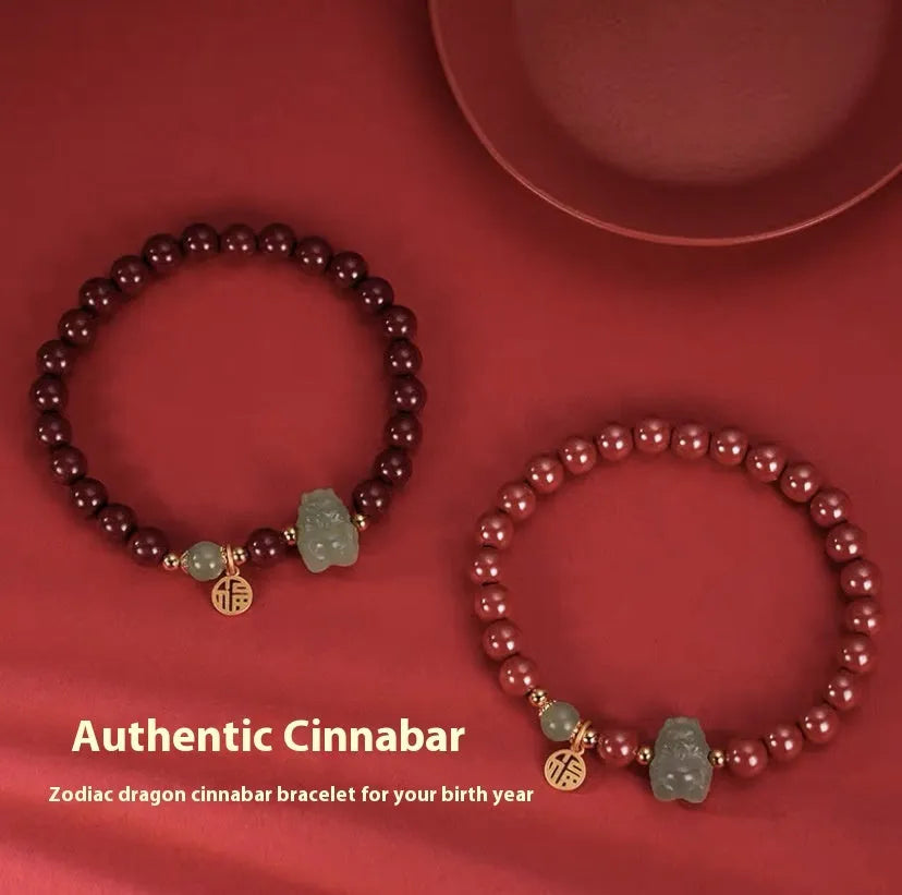 Handmade Hetian jade bracelet with cinnabar inlay showing 8mm beads and animal zodiac modelling