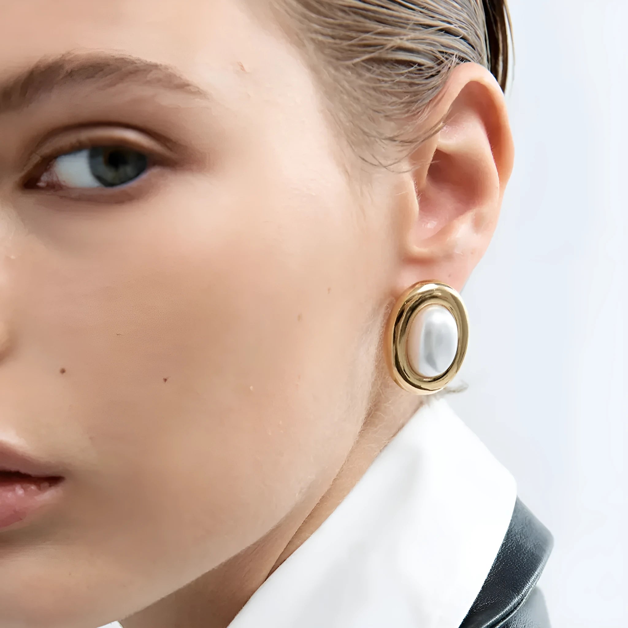 Stainless steel vintage pearl ear studs for women with electroplated finish.