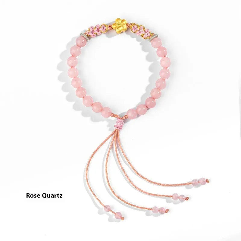 Hand-woven red rope bracelet with diamond-shaped crystal peach blossom elements in Chinese style