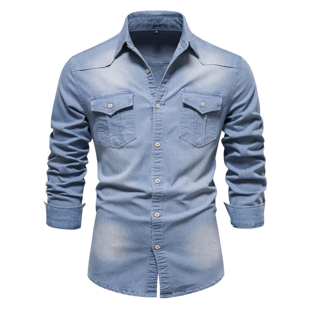 Men's slim fit long sleeve denim shirt in a solid colour on a hanger.