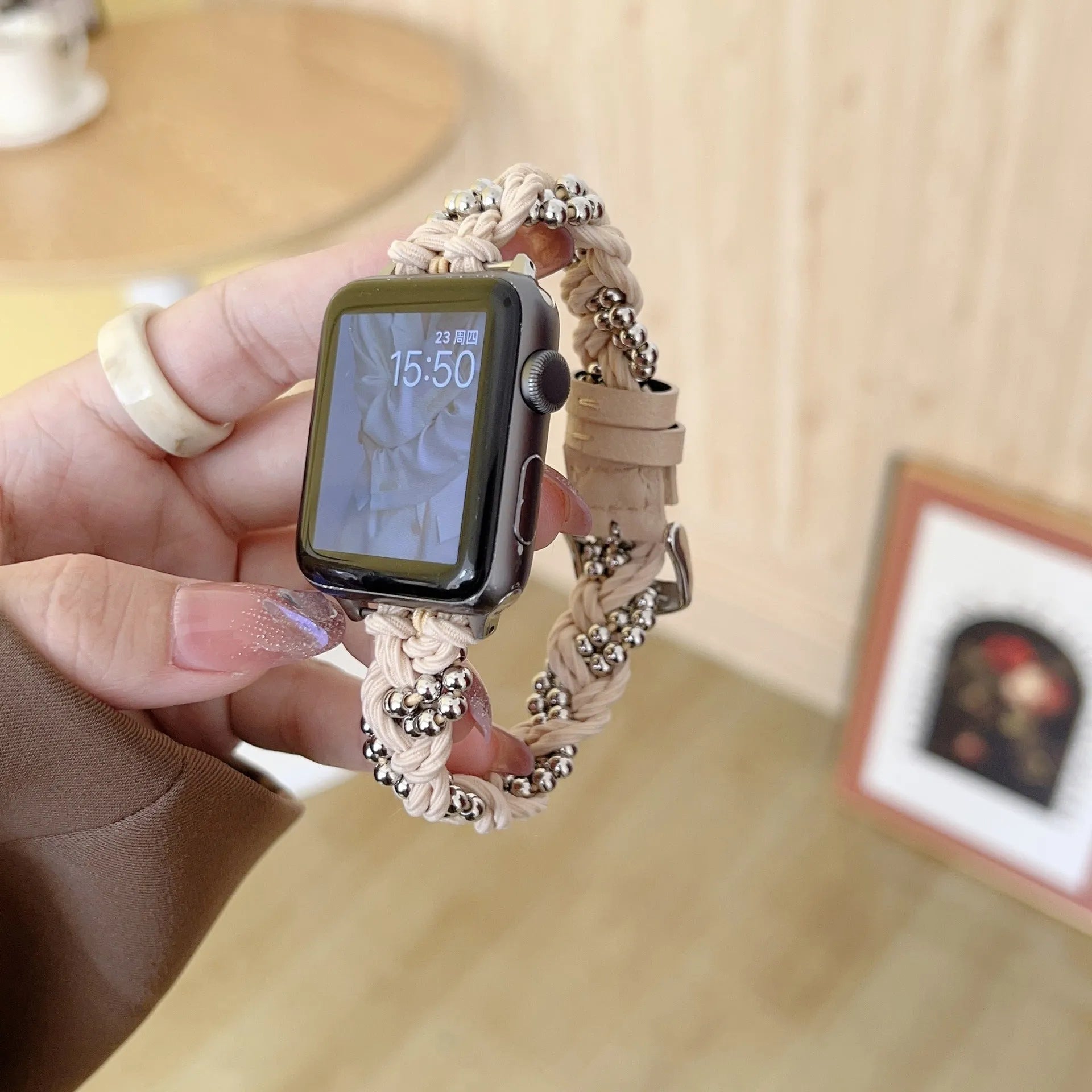 Grey elastic steel ball chain watch strap on wrist compatible with Apple Watch 38mm to 45mm