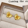 A pair of retro-style flower earrings with petal design, shown in gold electroplated finish.