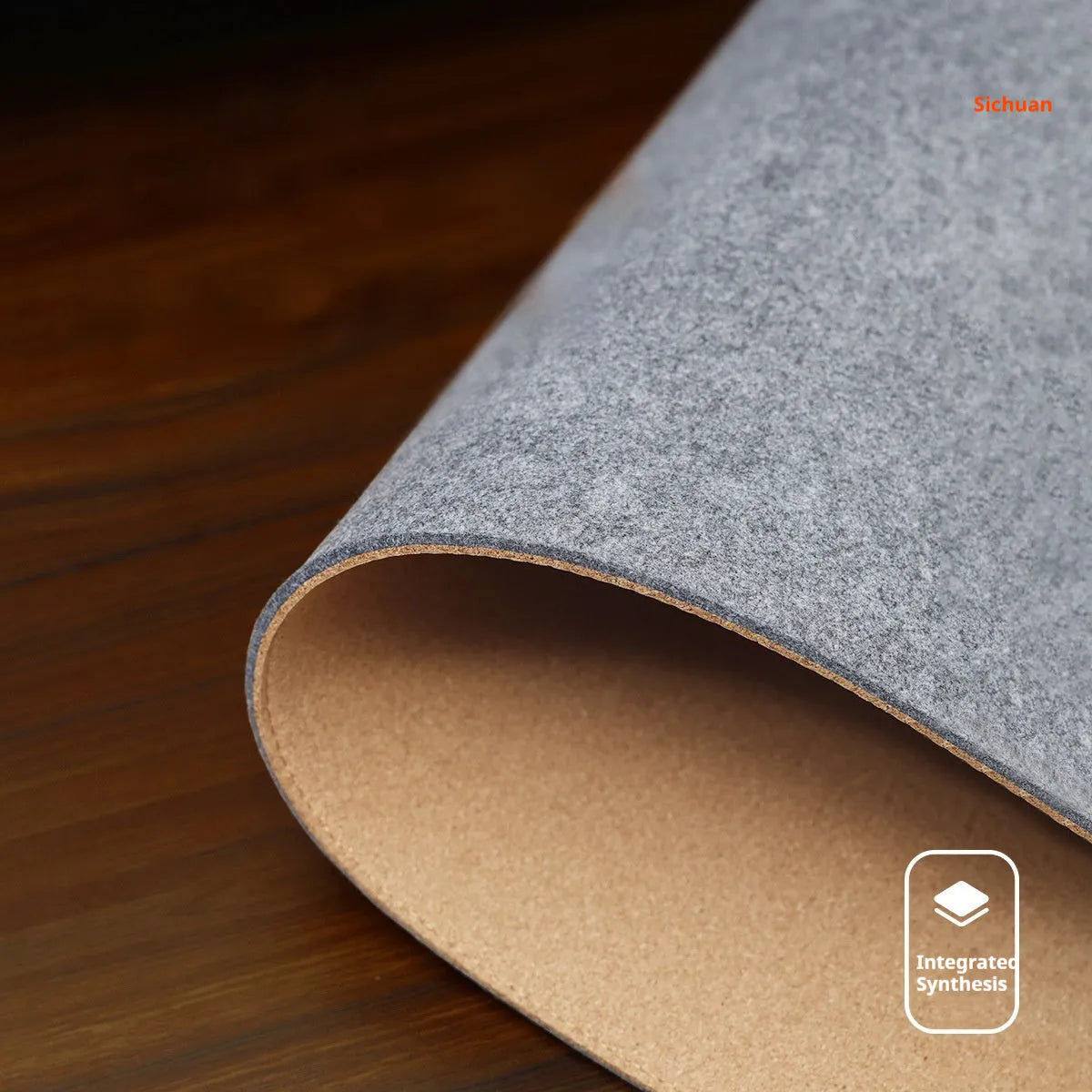 Felt cork desk mat in black gray pattern on a wooden desk with a mouse and keyboard