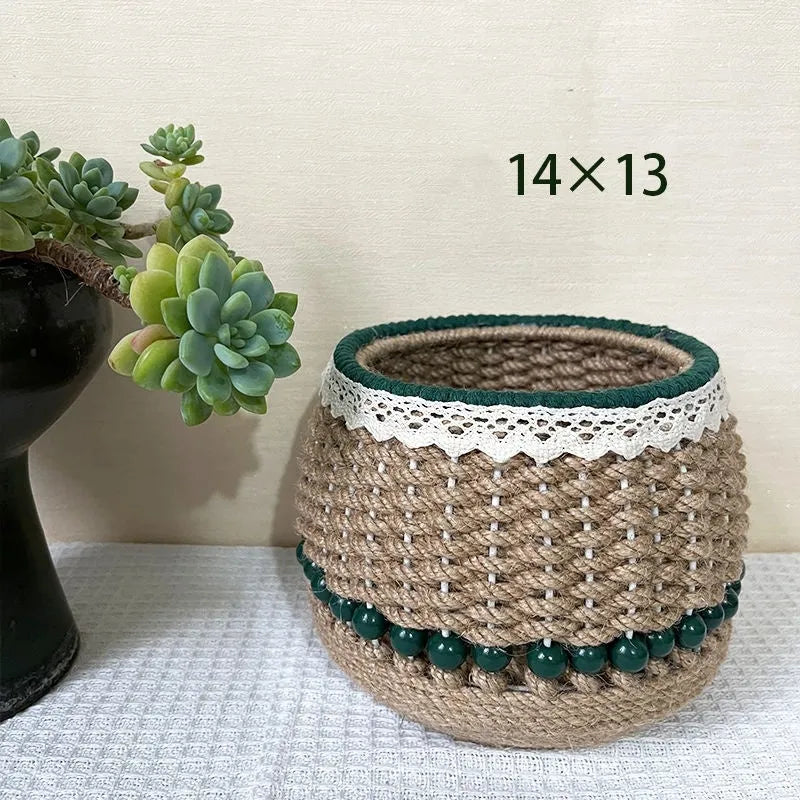 Hand woven rattan cylinder storage basket in solid green on a table, holding snacks and sundries