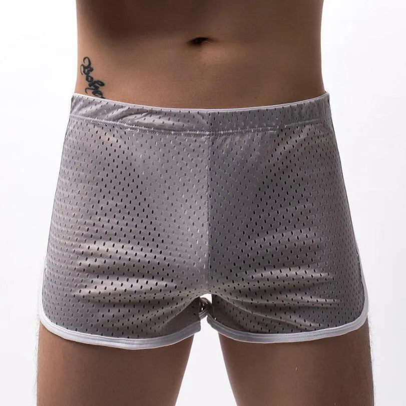 Men's black three-point boxer shorts made from a knitted cotton and nylon blend on a plain background.
