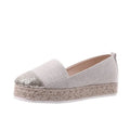 Women's plus size black canvas slip-on flat shoes with round toe, shown from the side.