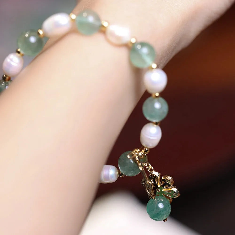 Green freshwater pearl bracelet with Chinese knot design and peace buckle closure