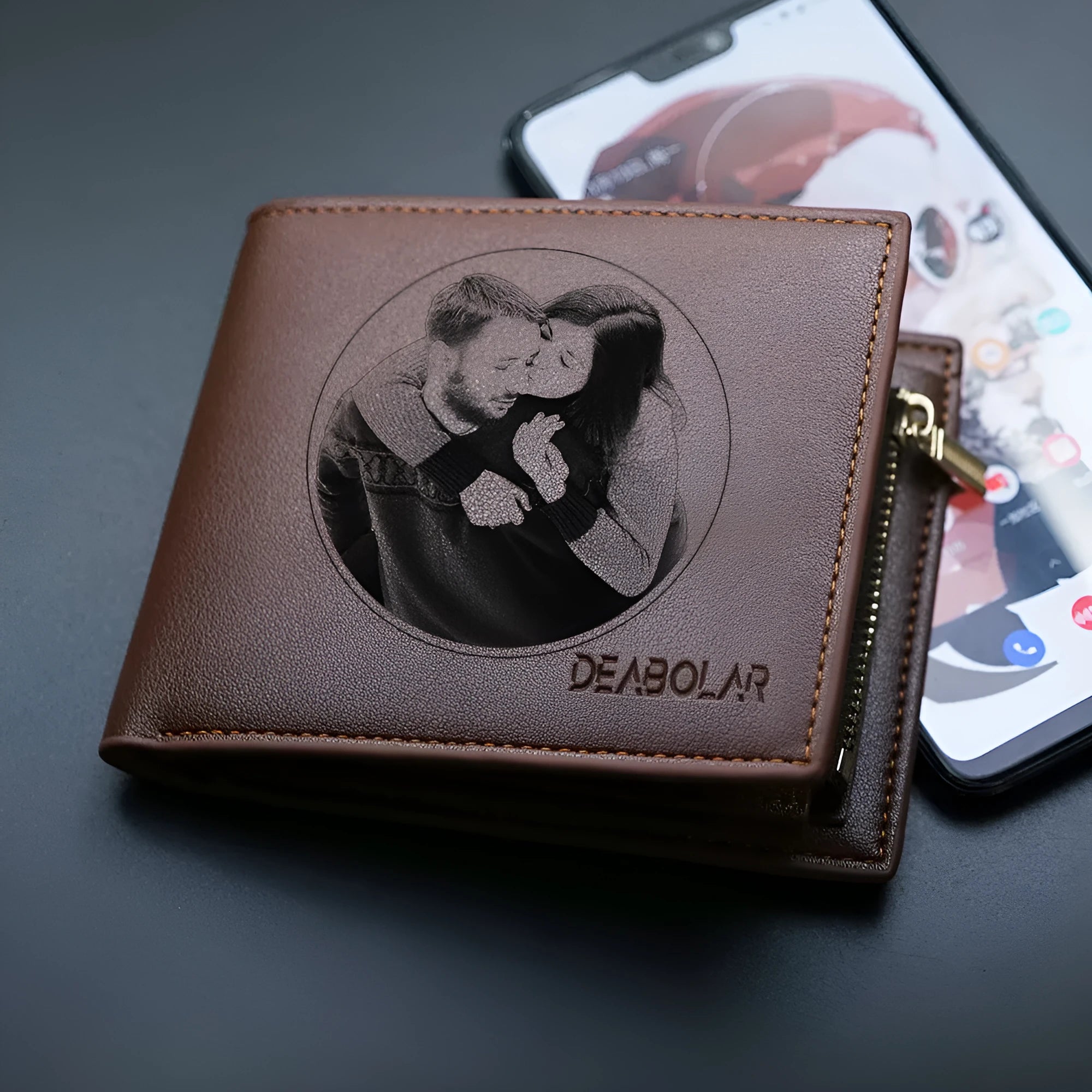 Men's brown leather wallet with a gold zipper closure laid flat.