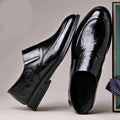 Men's black PU pointed toe slip-on formal shoes with rubber sole and metal detailing on a white background
