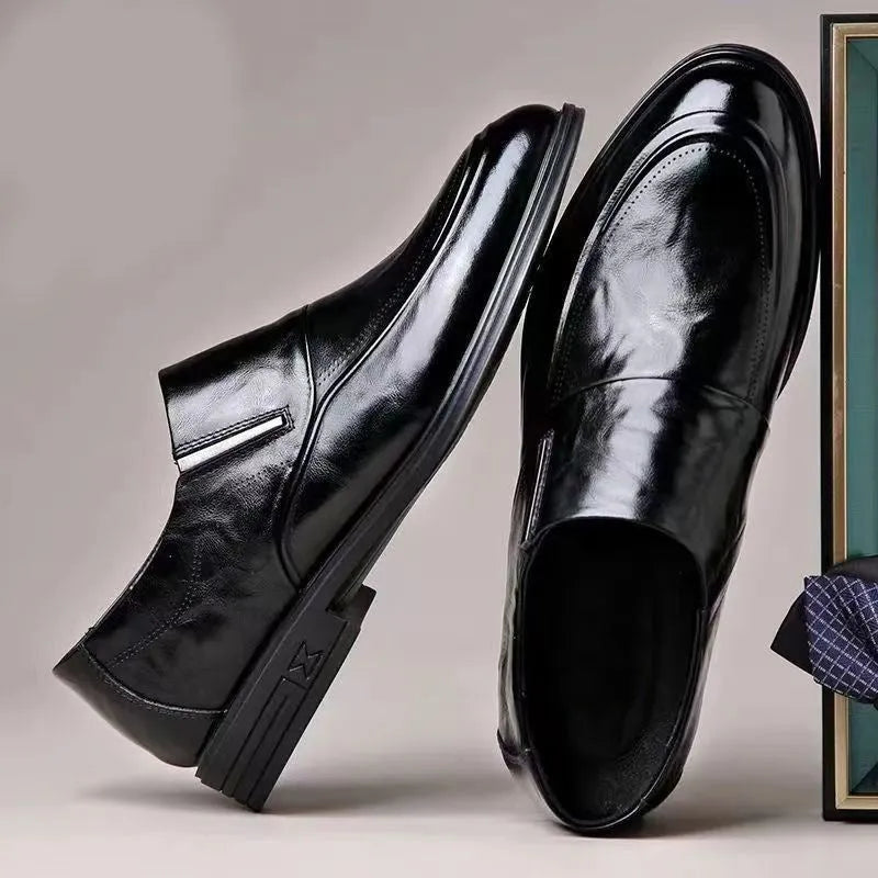 Men's black PU pointed toe slip-on formal shoes with rubber sole and metal detailing on a white background