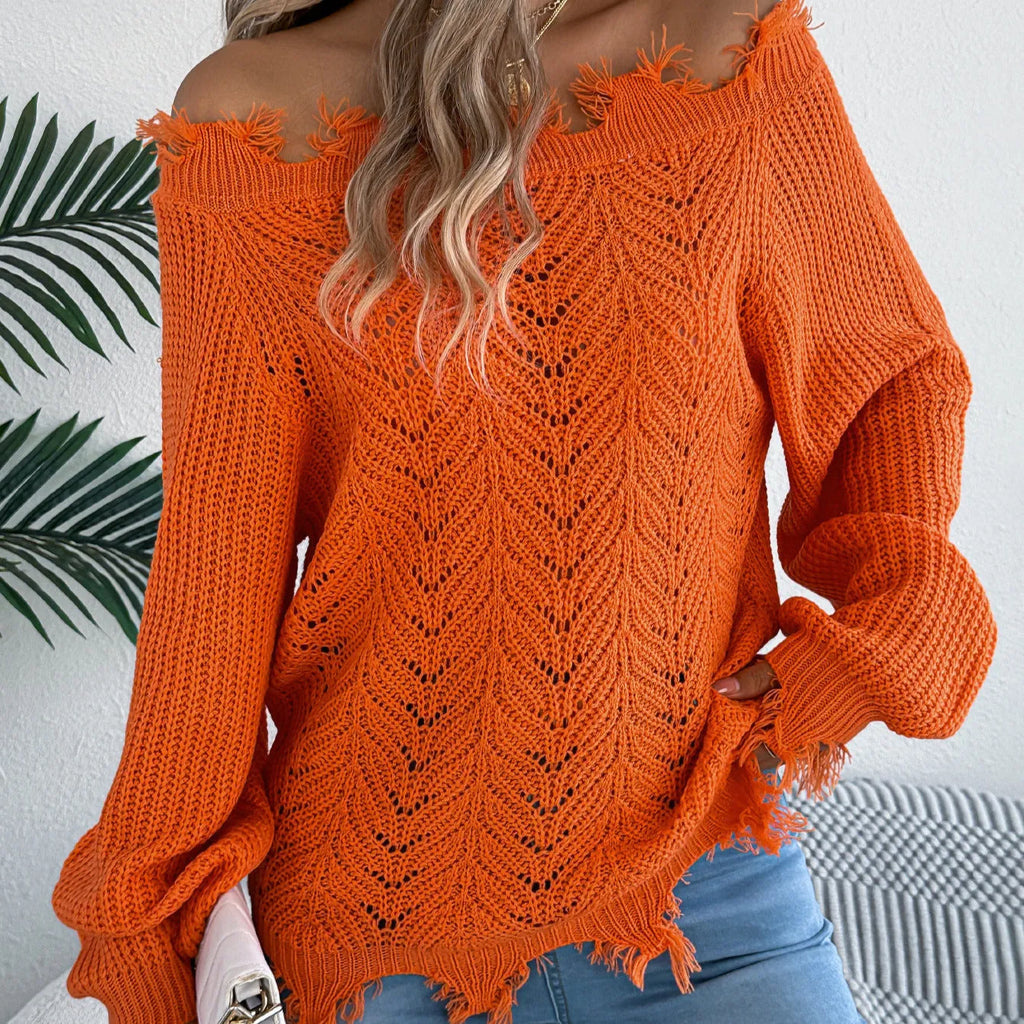 White cut-off-shoulder pullover sweater with hollow-out long sleeves on a mannequin.