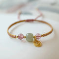Adjustable red rope bracelet with strawberry quartz gemstones in traditional Chinese style