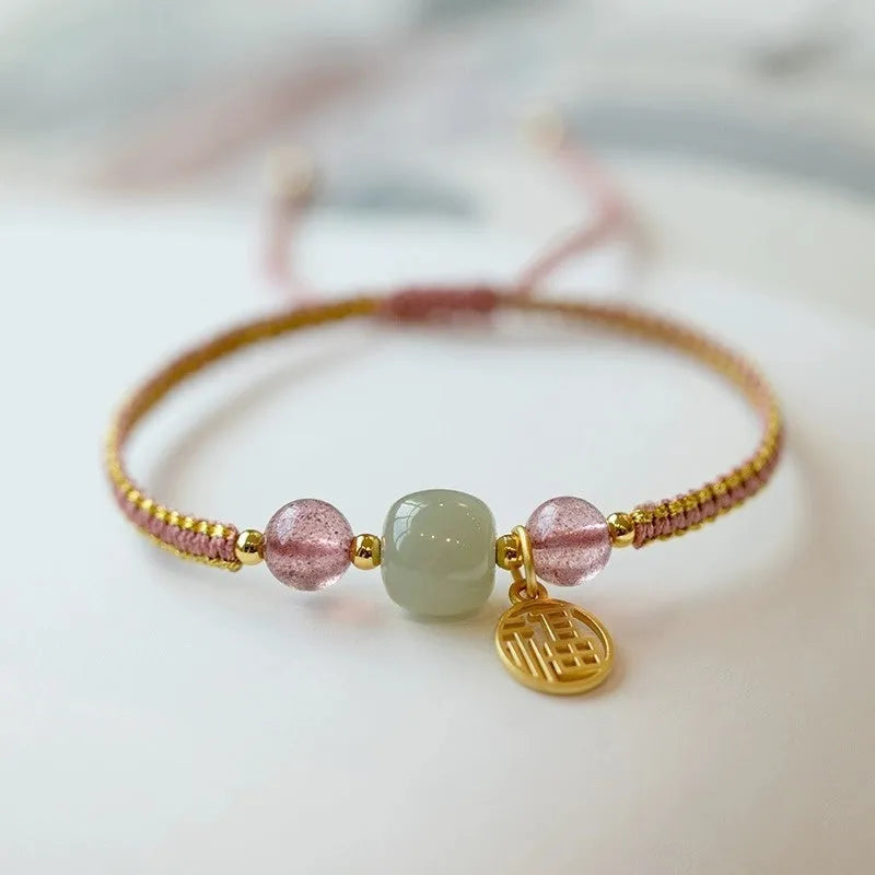 Adjustable red rope bracelet with strawberry quartz gemstones in traditional Chinese style