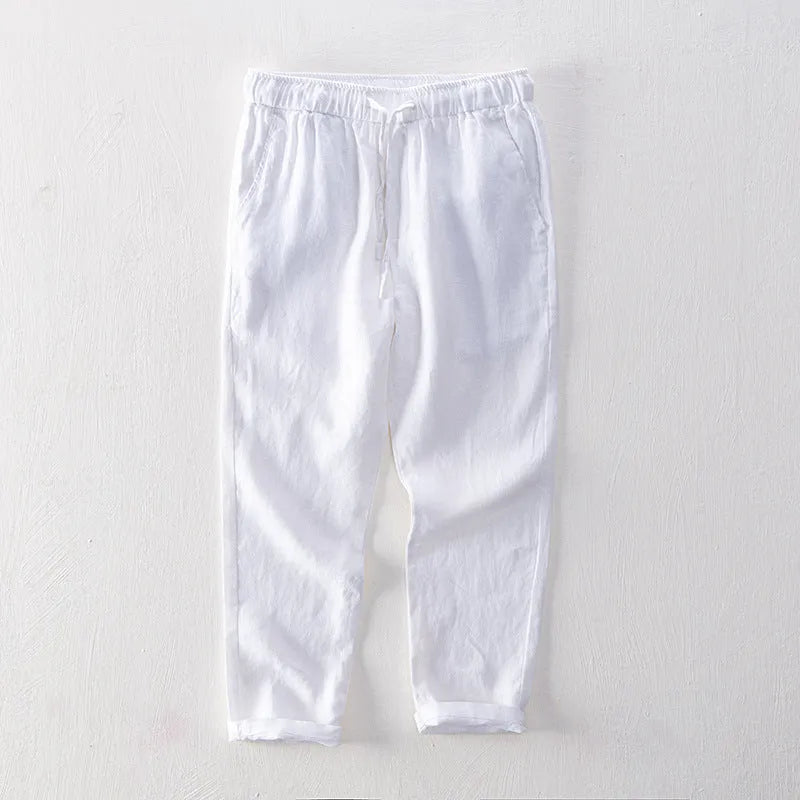 Men's straight-leg linen trousers in light gray shown laid flat.