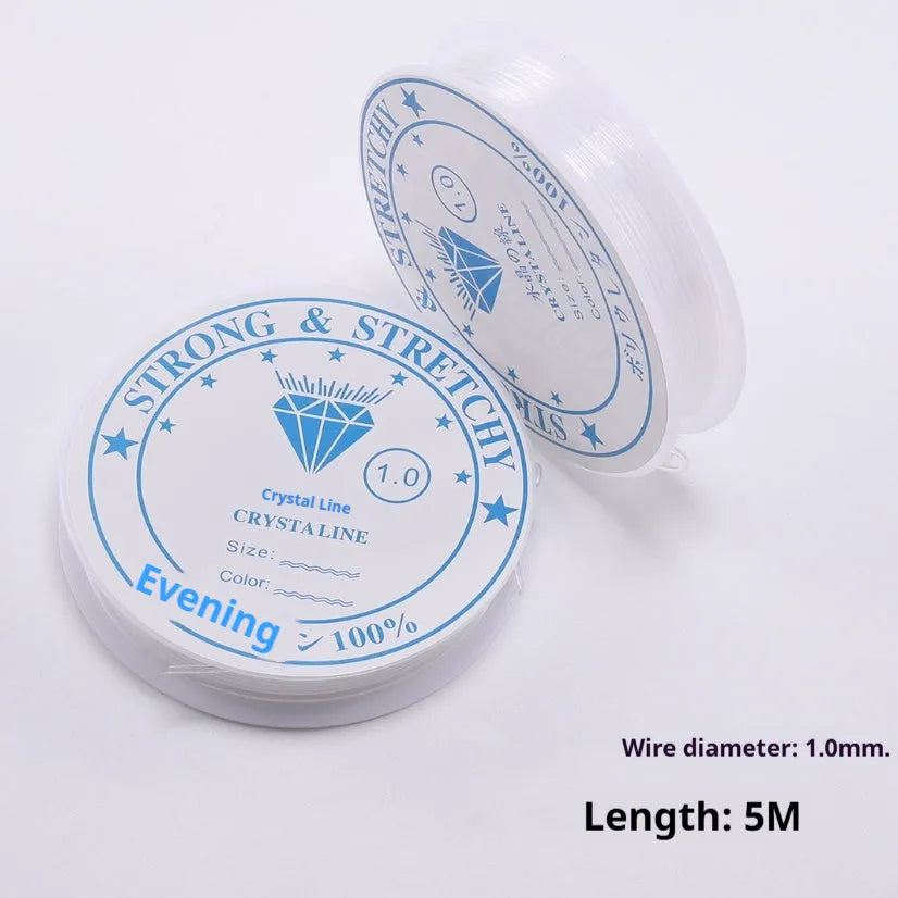 Coil of transparent white elastic fishing line cord for DIY jewellery and ornament making.