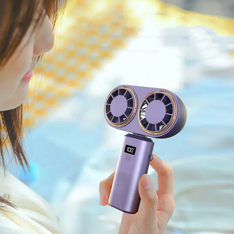 Folding USB rechargeable handheld mini fan with digital display showing battery level and wind speed setting