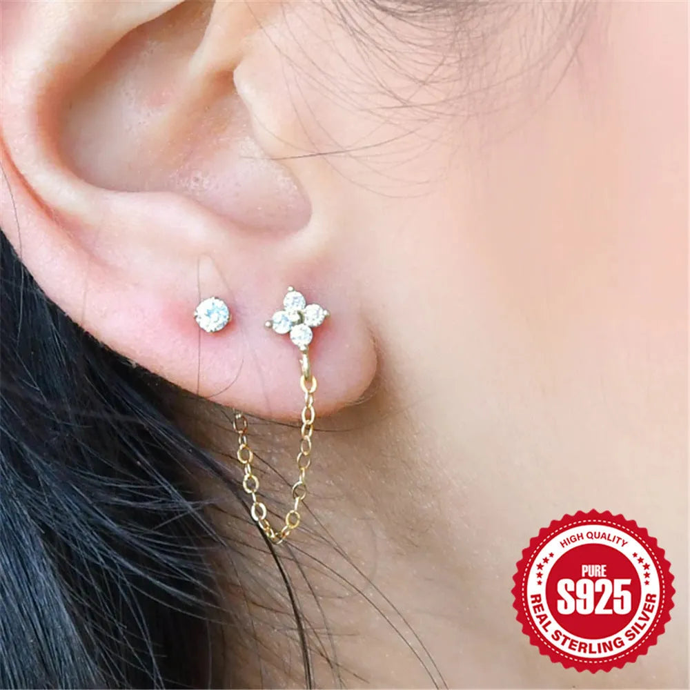 Golden S925 sterling silver stud earrings with a geometric diamond flower and delicate tassel chain design.