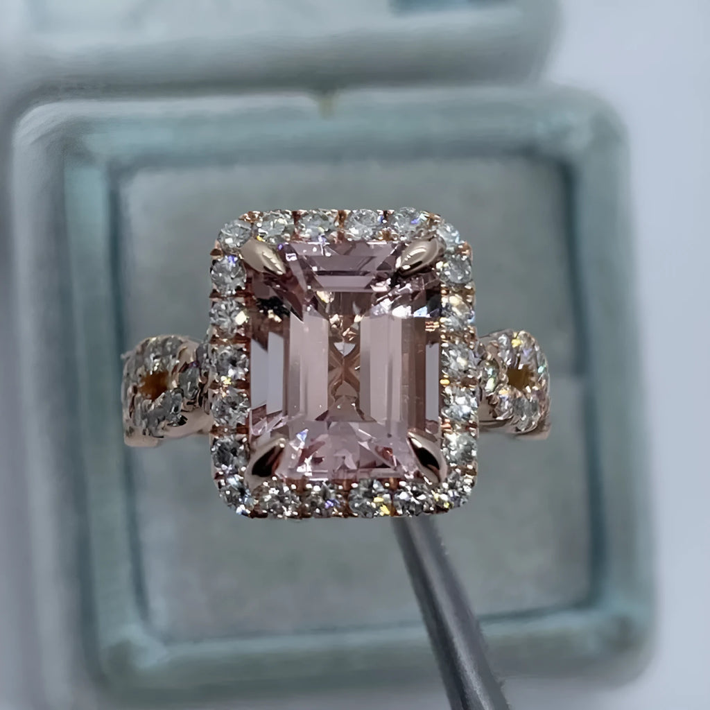Rose gold geometric alloy ring on a plain background, showing its shape and electroplated finish.