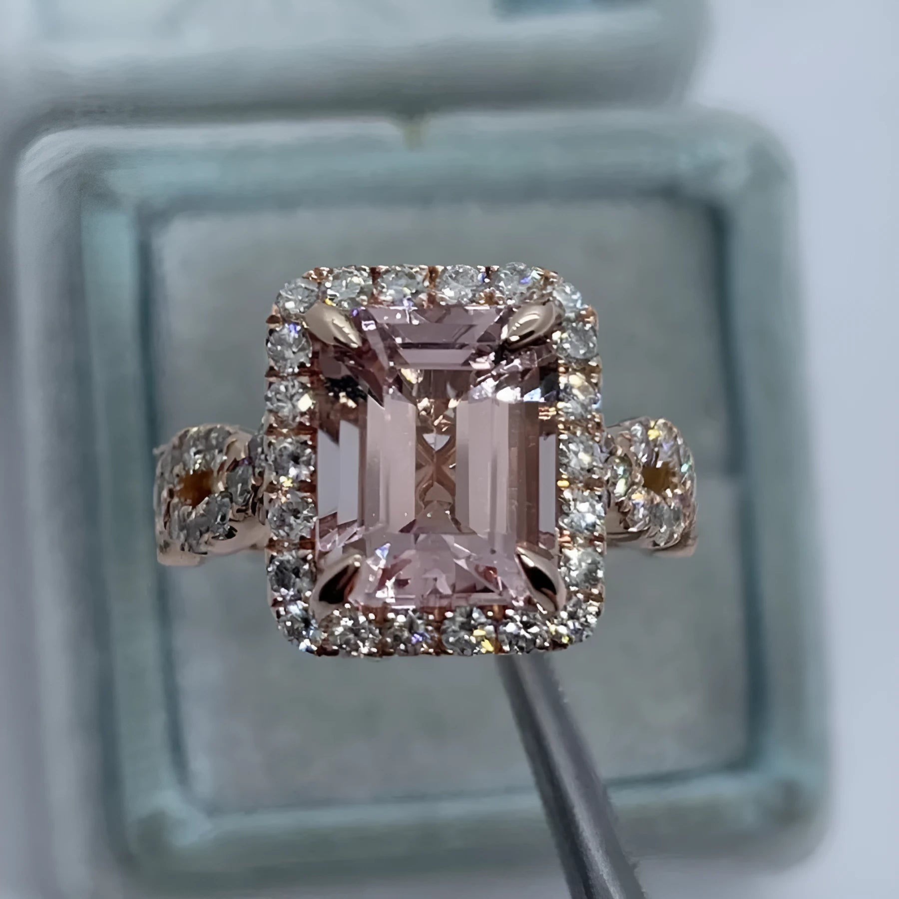 Rose gold geometric alloy ring on a plain background, showing its shape and electroplated finish.