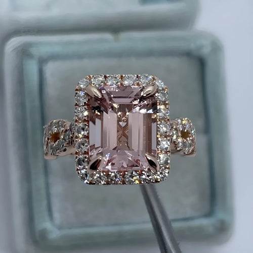 Rose gold geometric alloy ring on a plain background, showing its shape and electroplated finish.