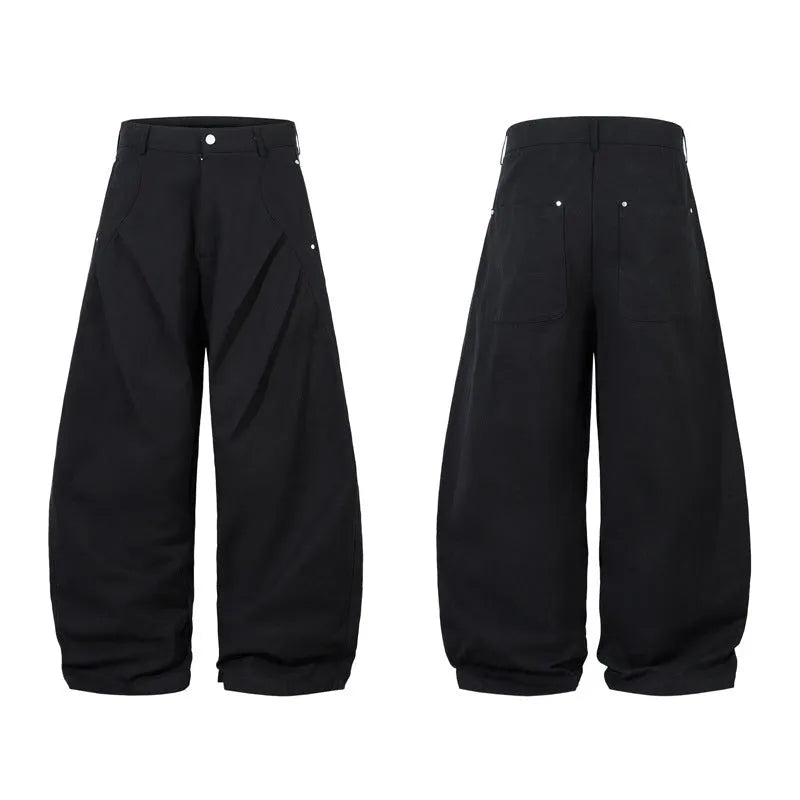 Black men's pleated casual trousers with a loose wide-leg fit on a hanger