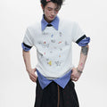 Men's blue cartoon printed short sleeve shirt with contrasting panels and loose fit design