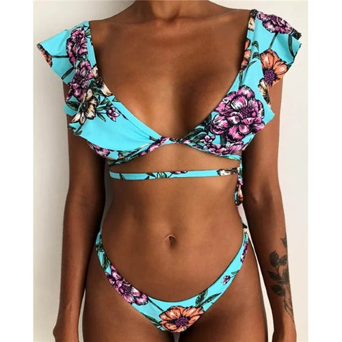 Yellow floral print split bikini swimsuit set for surfing on mannequin