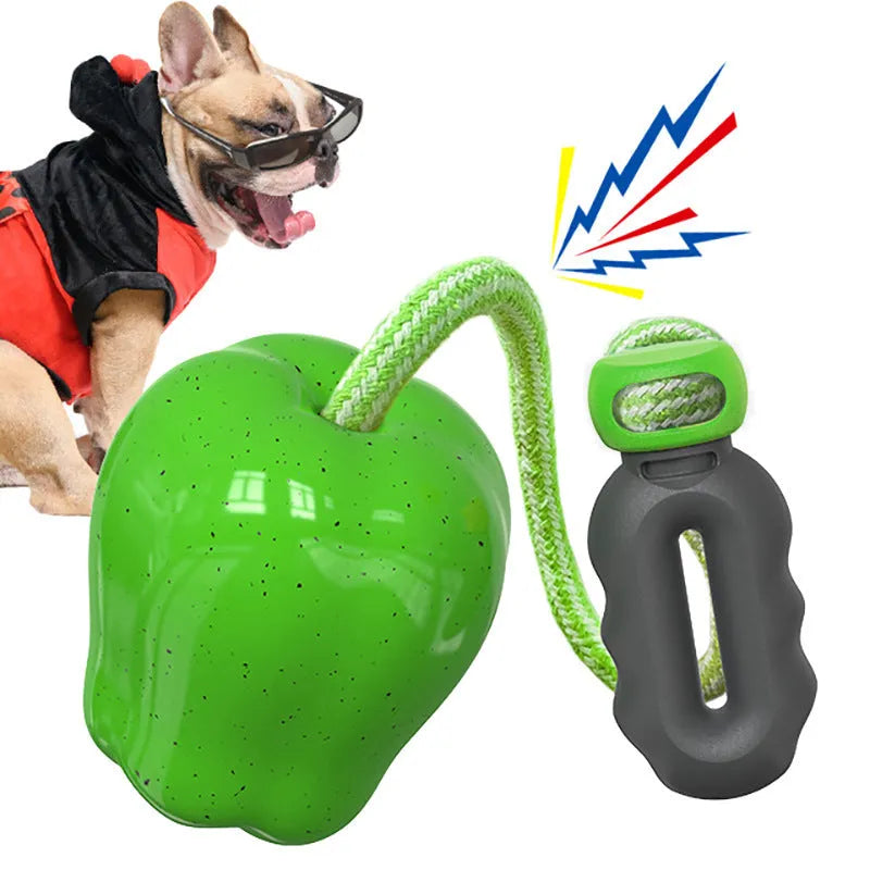 Green and red plastic dog toy shaped like a molar with a hollow centre for treat dispensing.
