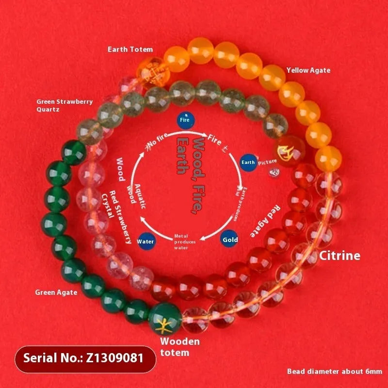 Handmade women's crystal double ring bracelet in five elements colours on a wrist.