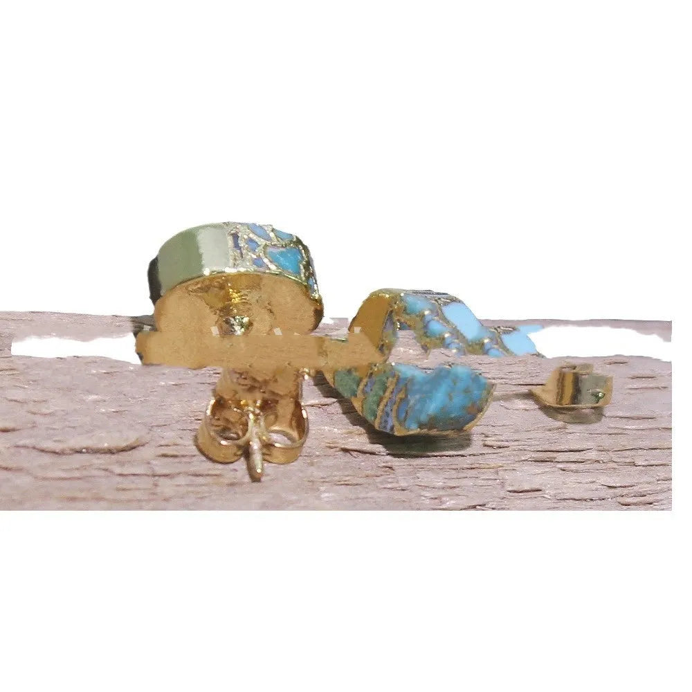 Close-up of handcrafted bohemian stud earrings with an irregular natural stone in colour ER1031 on a simple metal setting.