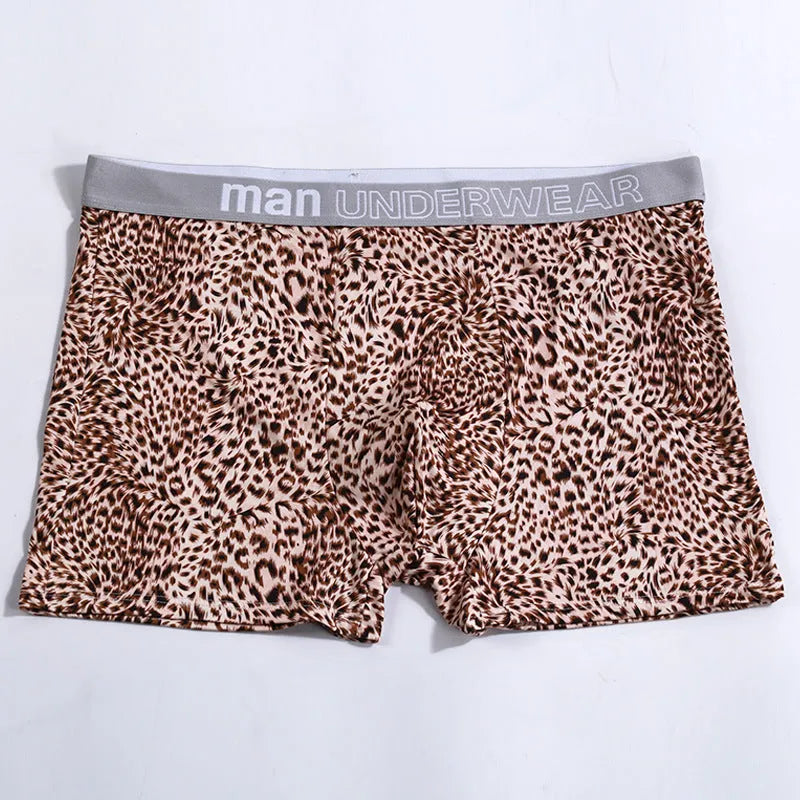 Men's loose fit leopard print underwear in grey and yellow, showing mid-waist design and soft fabric texture.