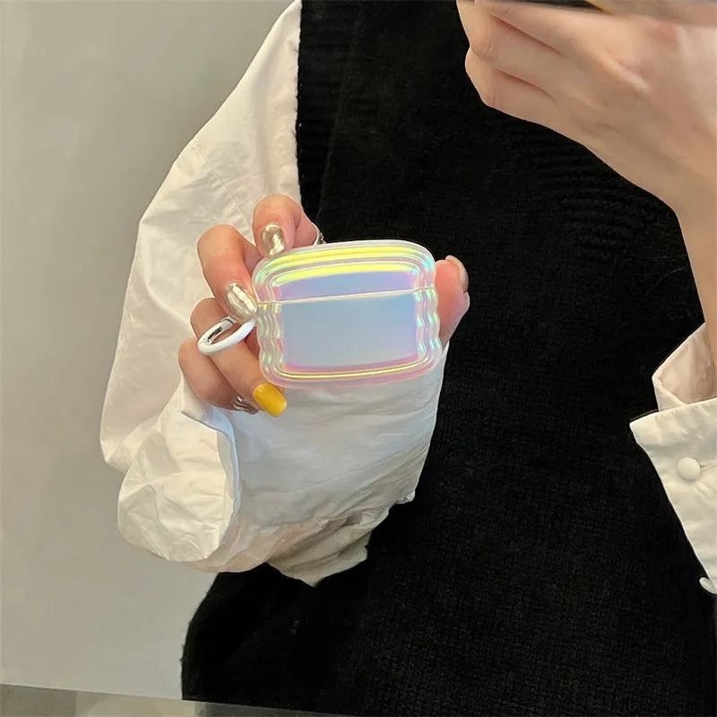 Silicone case with laser engraving and a coloured ring for Apple AirPods charging case.