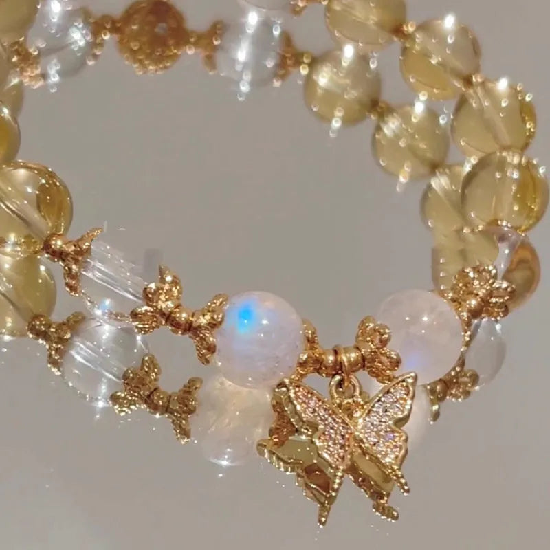 Moonstone white crystal bracelet with citrine butterfly motif and elastic closure