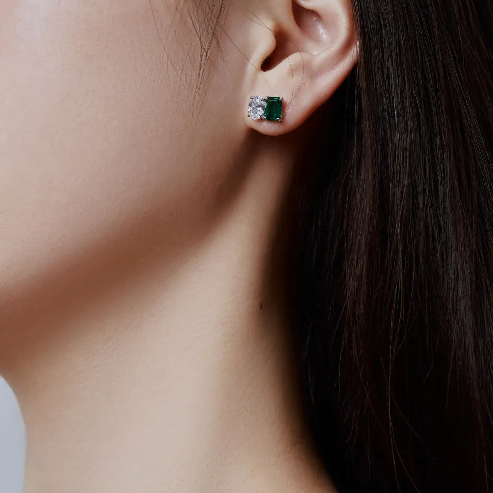 Silver stud earrings with emerald green stone in geometric ellipse and quadrilateral shape