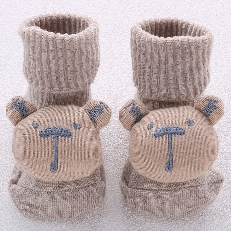 Cotton baby floor socks in multiple designs including panda, bow, and star patterns.