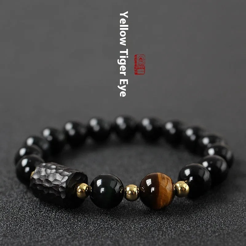 Obsidian bracelet with 10mm yellow tiger eye beads showing manual processing details and retro circle style