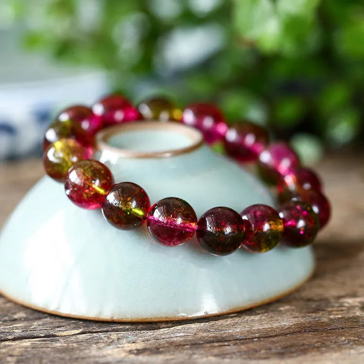 Women's watermelon crystal bracelet showing pastoral design elements on wrist