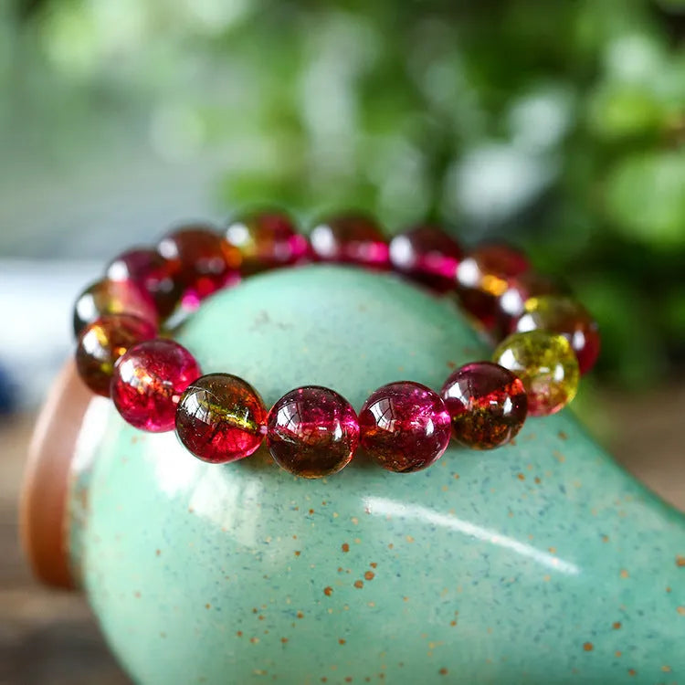 Women's watermelon crystal bracelet showing pastoral design elements on wrist