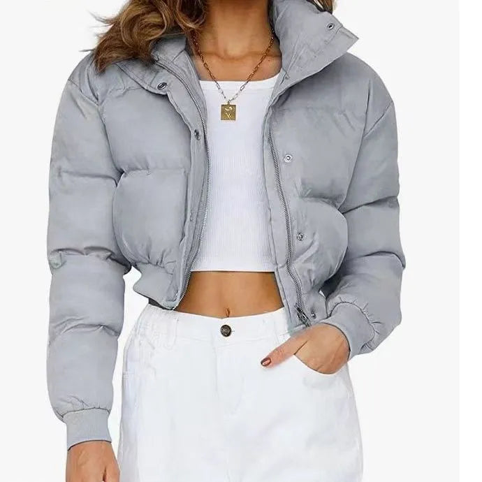 Loose fit blue women's polyester jacket with long sleeves on a hanger