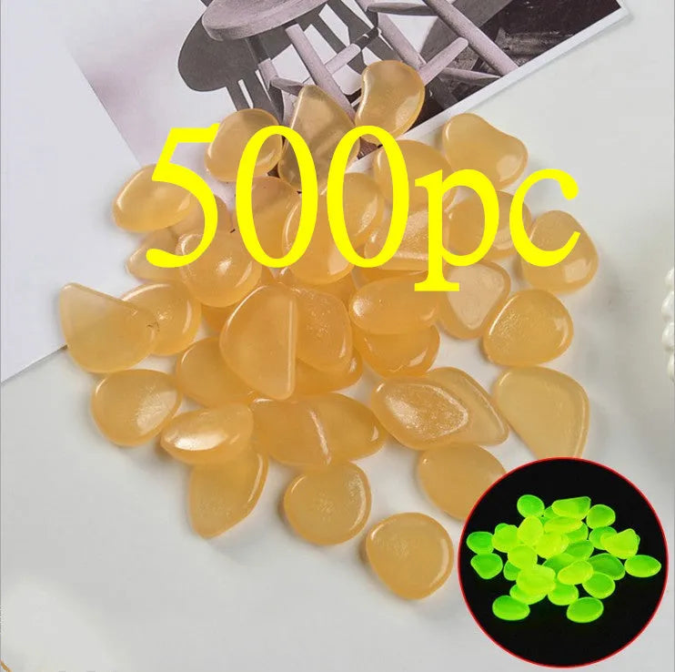 Luminous fluorescent aquarium and garden pebbles in mixed colours including dark purple, yellow, light blue, pink, orange