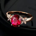Women's butterfly ring with heart design in 18k rose gold plating, red and blue colour options