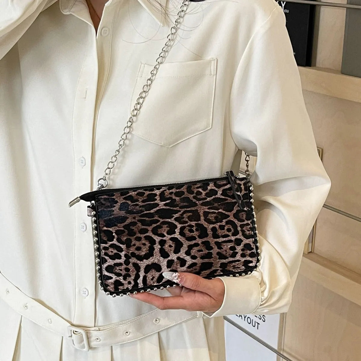 Women's square crossbody bag in PU leather with chain detail, shown in dark brown colour