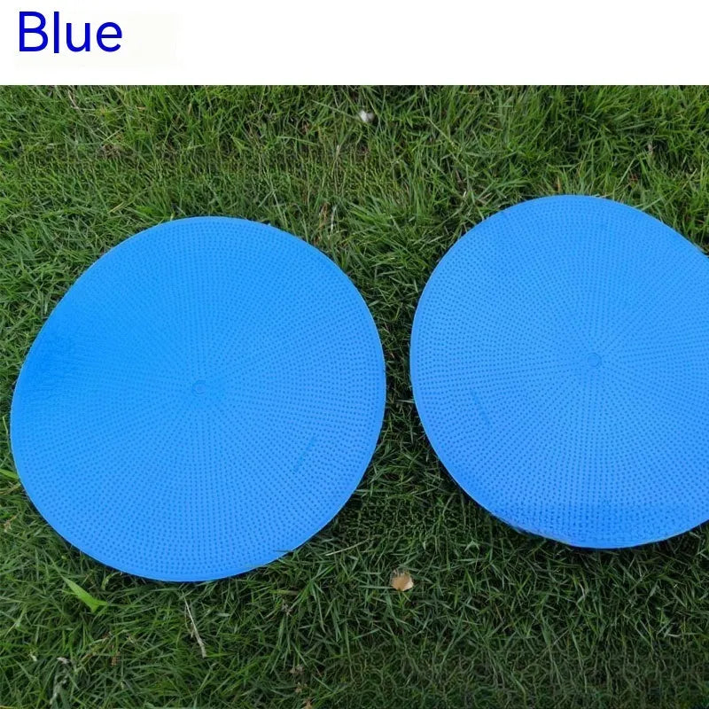 23cm diameter football training landmark pad in bright colours on grass field