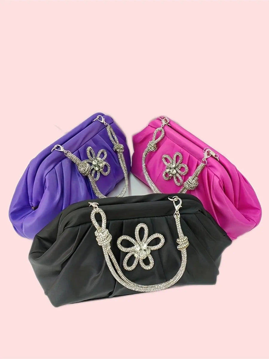 Women's black polyester messenger bag with chain detail, diamond patterns, and document organiser compartment