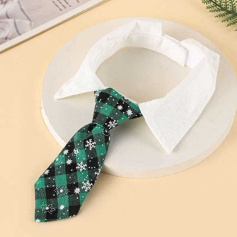 Adjustable Christmas dog necktie in red plaid with snowflake pattern, sized for small medium cats and dogs.