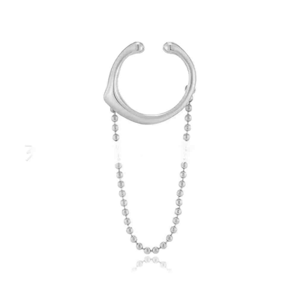 Ball chain tassel ear clip in gold on left ear, copper geometric U-shaped design