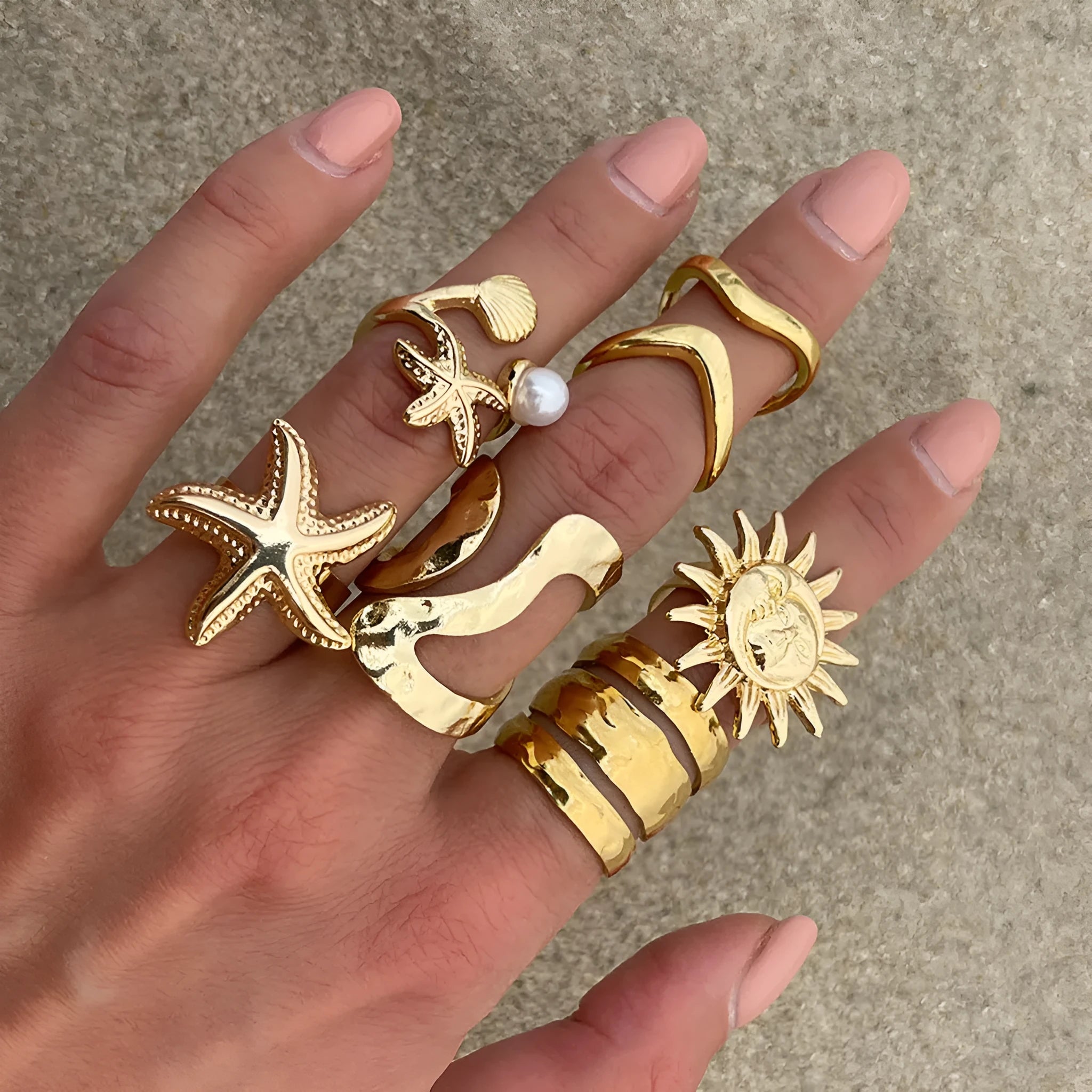 Women's irregular ocean shell ring set with starfish and fan shapes, light gold electroplated metal, 4-piece arrangement