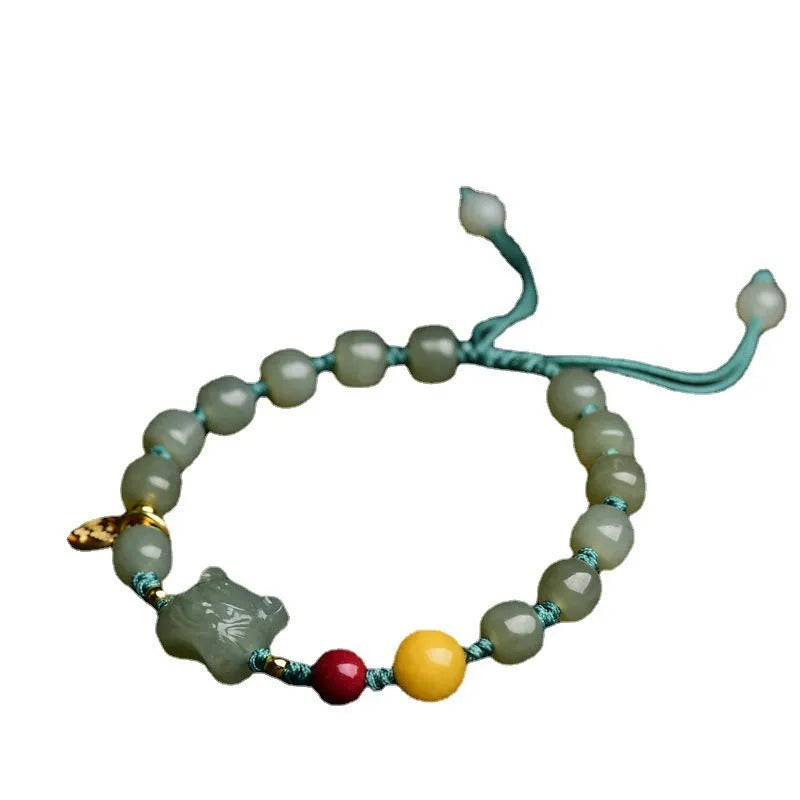 Natural Hetian jade bracelet with cinnabar and beeswax beads featuring animal modelling