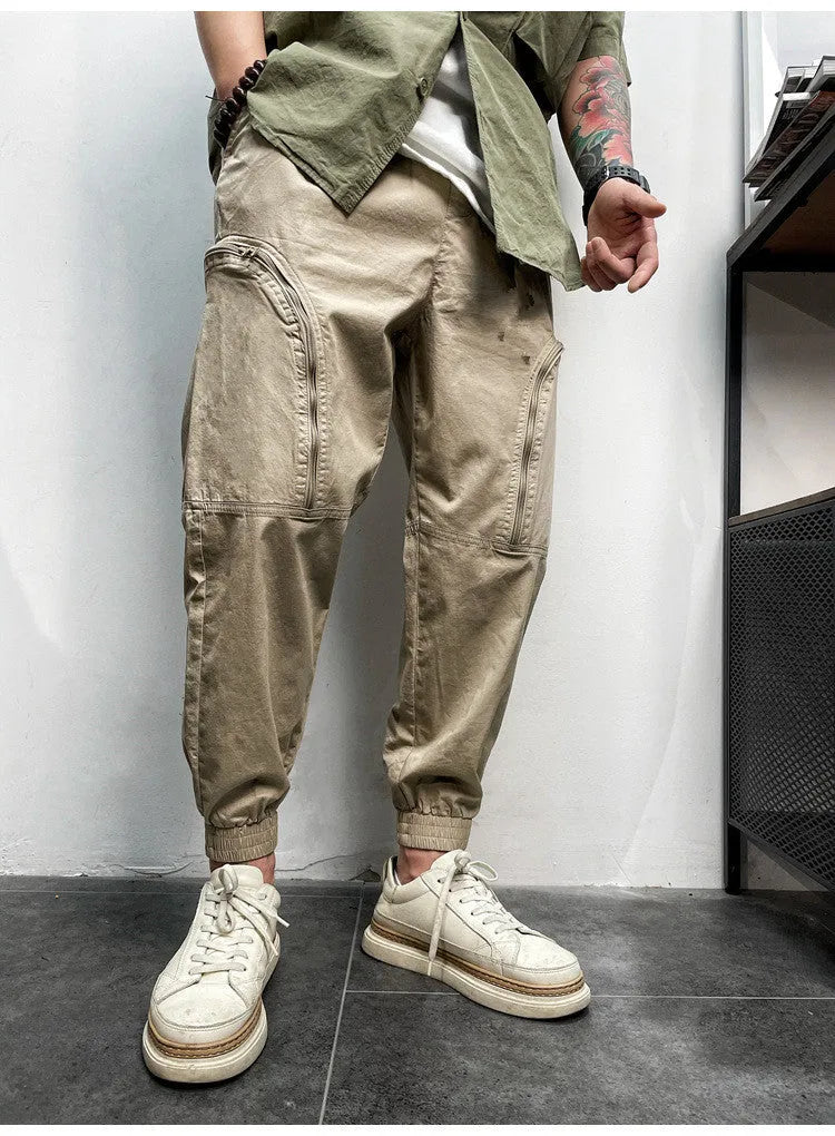 Men's loose fit cotton cargo trousers with elastic waist and zipper pockets in army green